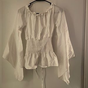 White renaissance type shirt, with long sleeves, corset style waist.
